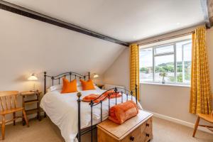 a bedroom with a bed and a window at 2 Bed in Bridport oc-dc110 in Chideock