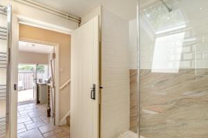 a glass shower in a bathroom with a glass door at 2 Bed in Bridport oc-dc110 in Chideock +22 photos