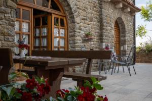 a wooden bench sitting outside of a stone building at San Mauro Countryside Retreat with Restaurant & Wine Cellar in Momjan +98 photos
