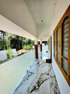 a room with a floor that has water on it at Beach Way Villa in Varkala