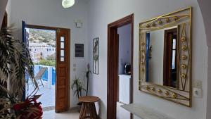 a hallway with a mirror on the wall at Sea Breeze Retreat in Lionas