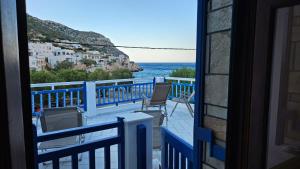 a balcony with a view of the ocean from a house at Sea Breeze Retreat in Lionas