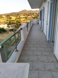 a balcony with a view of the mountains at Christos House in Zárakes