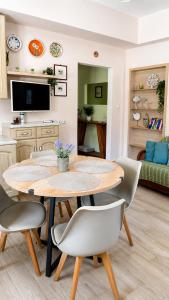 a dining room with a table and chairs at Seaside Serenity Kefalos in Kefalos