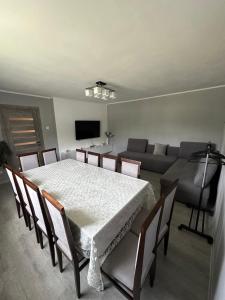 a living room with a table and a couch at HOUSE Mold in Lazeshchyna