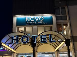 a hotel sign on the side of a building at Novo Premium Hotel by AS in Göttingen