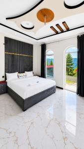 a bedroom with a large bed in a room at Nathia Gali Top Resort in Nathia Gali