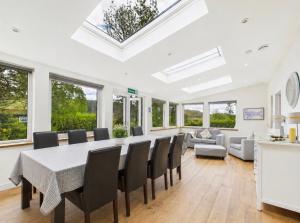 a dining room with a table and chairs at Lagnakeil Highland Lodges in Oban +41 photos