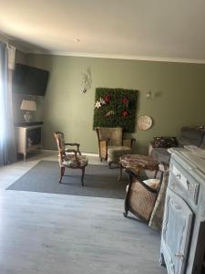 a living room with chairs and a couch at Gîte Aux Anges 51 in Thiéblemont-Farémont
