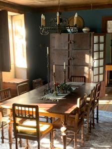 a dining room with a wooden table and chairs at Manor House Dungeon in Chozendo
