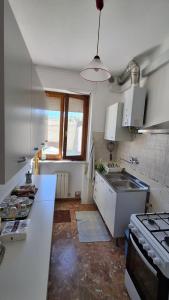 a kitchen with a sink and a counter top at Casa Panorama in Senigallia