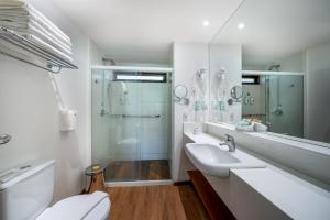 a bathroom with a toilet and a sink and a shower at Salinas Maragogi All Inclusive Resort in Maragogi