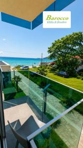 a balcony with a view of the ocean at Barocco Villa & Studios in Potamiá