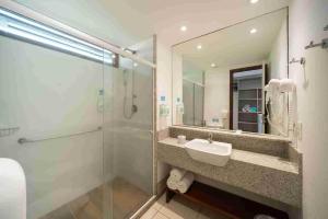 a bathroom with a sink and a shower at Salinas Maceio All Inclusive Resort in Maceió +43 photos