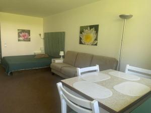 a living room with a couch and a table at Alex in Balderschwang
