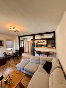 a living room with a couch and a table at Villa GoldenPearl in Povile