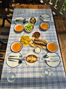 a table with a blue and white platter of food at Norral shelter 1 in Kajvall