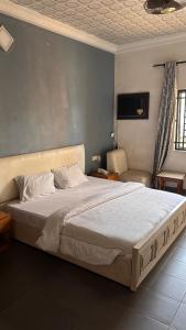 a bedroom with a large bed in a room at Diamond Hotel Lagos in Lagos