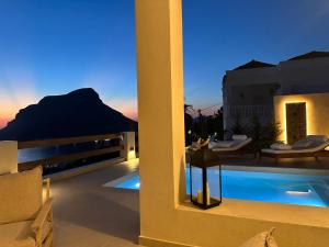 a view of a villa with a swimming pool at night at Villa Ino in Myrties
