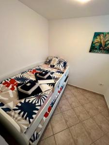 a bedroom with a bed in a room at Blue Coast Ivo in Piran