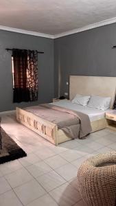 a bedroom with a large bed in a room at Diamond Hotel Lagos in Lagos