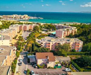 an aerial view of a city and the ocean at Linaya Hôtel & Restaurant in Bormes-les-Mimosas