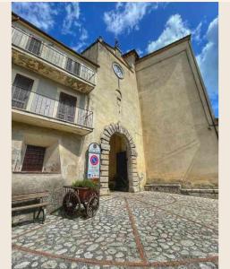 a building with a clock on the side of it at Mission Holiday in Penna in Teverina