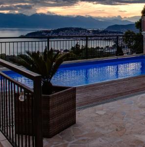 a swimming pool on the side of a building at Villa Aurora in Ohrid