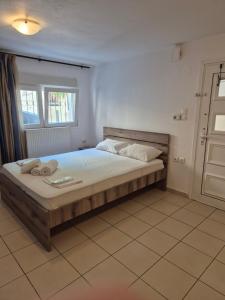 a bedroom with a large bed in a room at Blue studio in Kavála