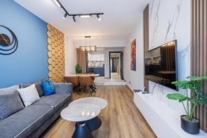 a living room with a couch and a table at Boulevard Hotel in Aytos