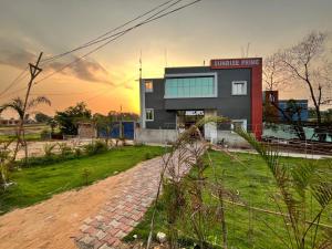 a building with a brick path in front of it at Sunrise Prime in Kānke