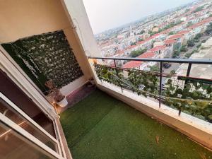 a balcony with a view of a city at Skyline suites in Greater Noida