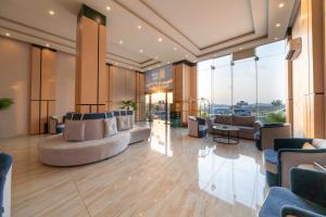 a lobby with couches and chairs in a building at القصر الإسكان in Khamis Mushayt