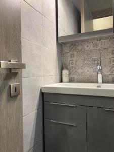 a bathroom with a sink and a mirror at Villa J&C-SAINT AIMILIANOS in Porto Heli +20 photos
