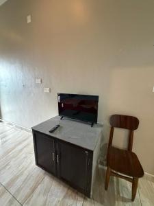 a desk and a chair in a room at Willow Nest in Anachal