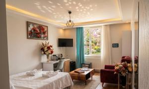 a hotel room with a bed and a desk at Mavi OTEL BOUTİQUE RESTAURANT in Mahmutlu +22 photos