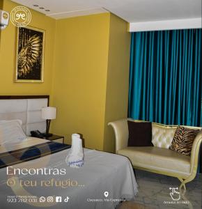 a bedroom with a bed and a couch and a chair at Hotel DPanda House in Cacuaco
