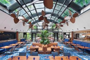 a rendering of a restaurant with tables and chairs at South Gate Hotel Okinawa Naha Tomari Port - Direct Access to Tomarin in Naha