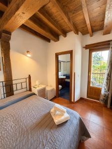 a bedroom with a bed and a large window at Posada El Valle - Adults Only in Suances