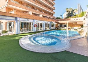 a swimming pool in the middle of a building at Hotel Tropic in Cala de Finestrat