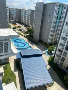 an aerial view of an apartment complex with a swimming pool at Davao Cozy Condo unit 1 in Davao City