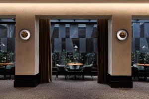 a lobby with a table and chairs in a room at Electra Palace Thessaloniki in Thessaloniki +74 photos