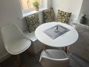 a white table and chairs in a room at Scorpio 1 in Burton upon Trent +61 photos