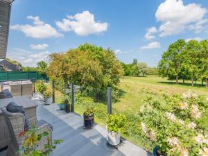 a balcony with plants and a view of a field at Sunnyfields in Cambridge