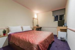 מיטה או מיטות בחדר ב-Citic Hotel