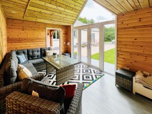 a living room with a couch and a table at Stronvaar in Stranraer