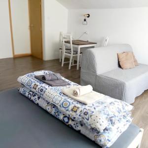 a bedroom with two beds and a table with a chair at Domeček in Třeboň