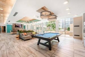 a pool table in the lobby of a building at Riverwalk View Luxe Condo Views Pool Free Parking in San Antonio