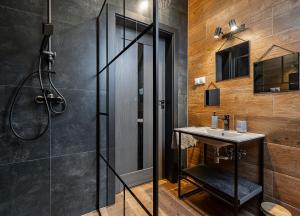 a bathroom with a shower and a sink at Bieszczadzka Panorama in Ustrzyki Dolne +42 photos