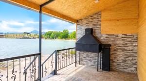 a balcony with a view of the water at Tsovazard Holiday House in Tsovazard